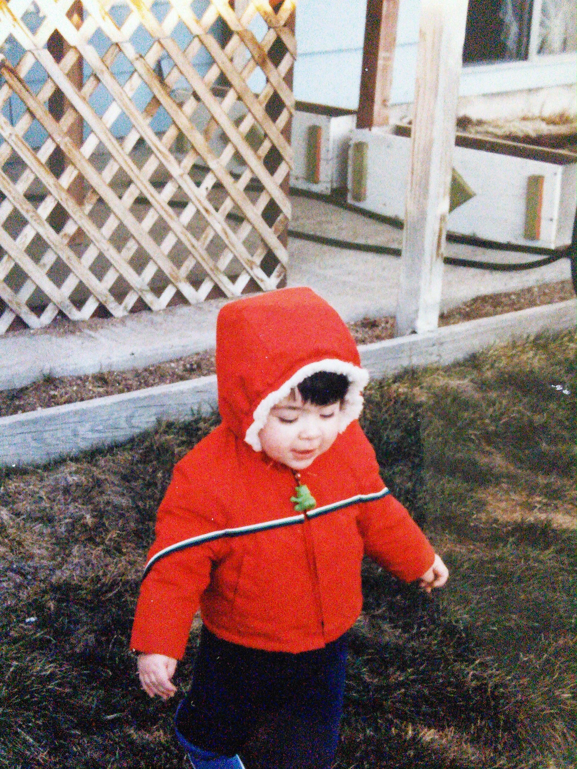 Just a photo of me as an infant wearing a red winter coat